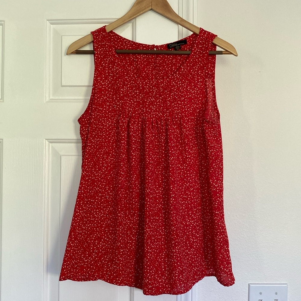 Dahlia polka dot sleeveless blouse.